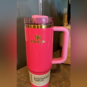 Pink with gold accents!!  Pink Parade 30 oz limited edition Stanley.  New